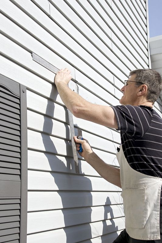 Vinyl siding being installed on a home